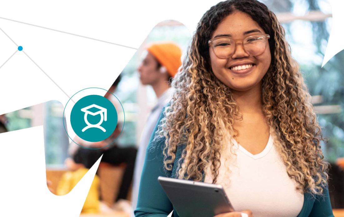 Photo of a teenage girl smiling into the camera, holding a tablet computer.